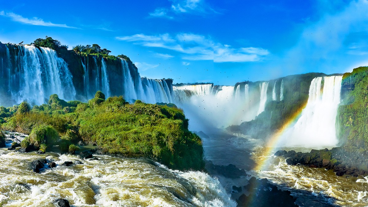 A panoramic view of Iguazu Falls from the upper circuit trail in Argentina.