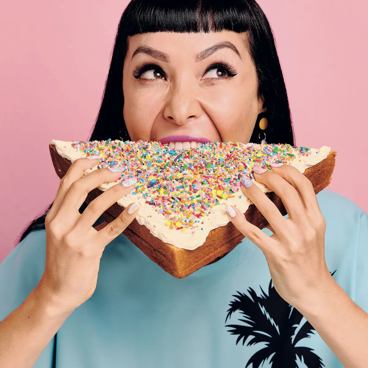  A platter of Fairy Bread triangles arranged on a serving tray.