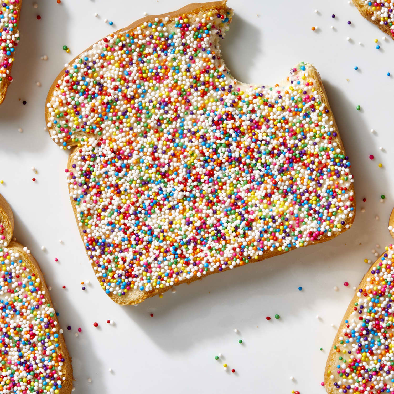 Fairy Bread pieces cut into fun shapes like stars and hearts, ready to be served.