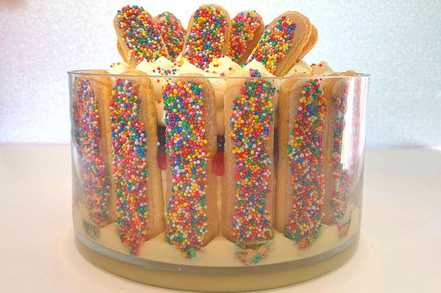 Freshly made Fairy Bread slices with a side of milk, showcasing a nostalgic childhood snack.