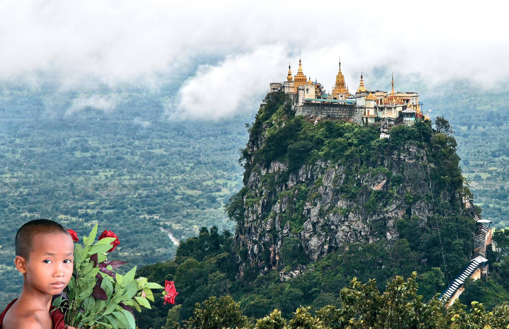 A breathtaking view of Mount Popa with lush green forests.
