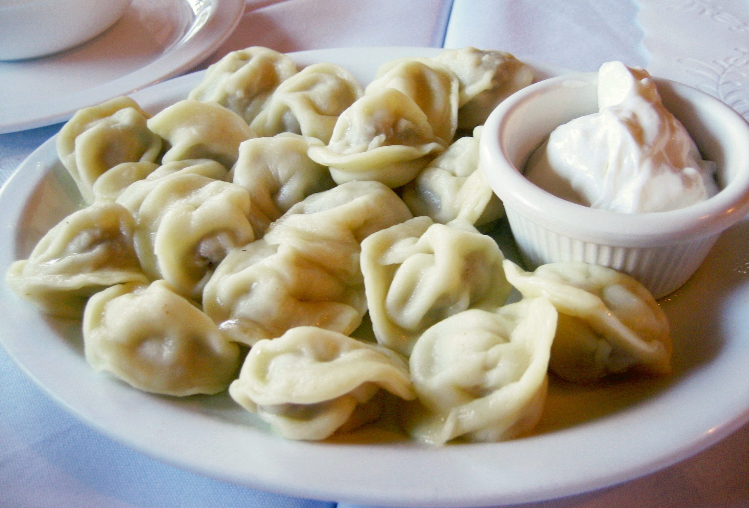 Fried pelmeni in a skillet with golden brown crust 