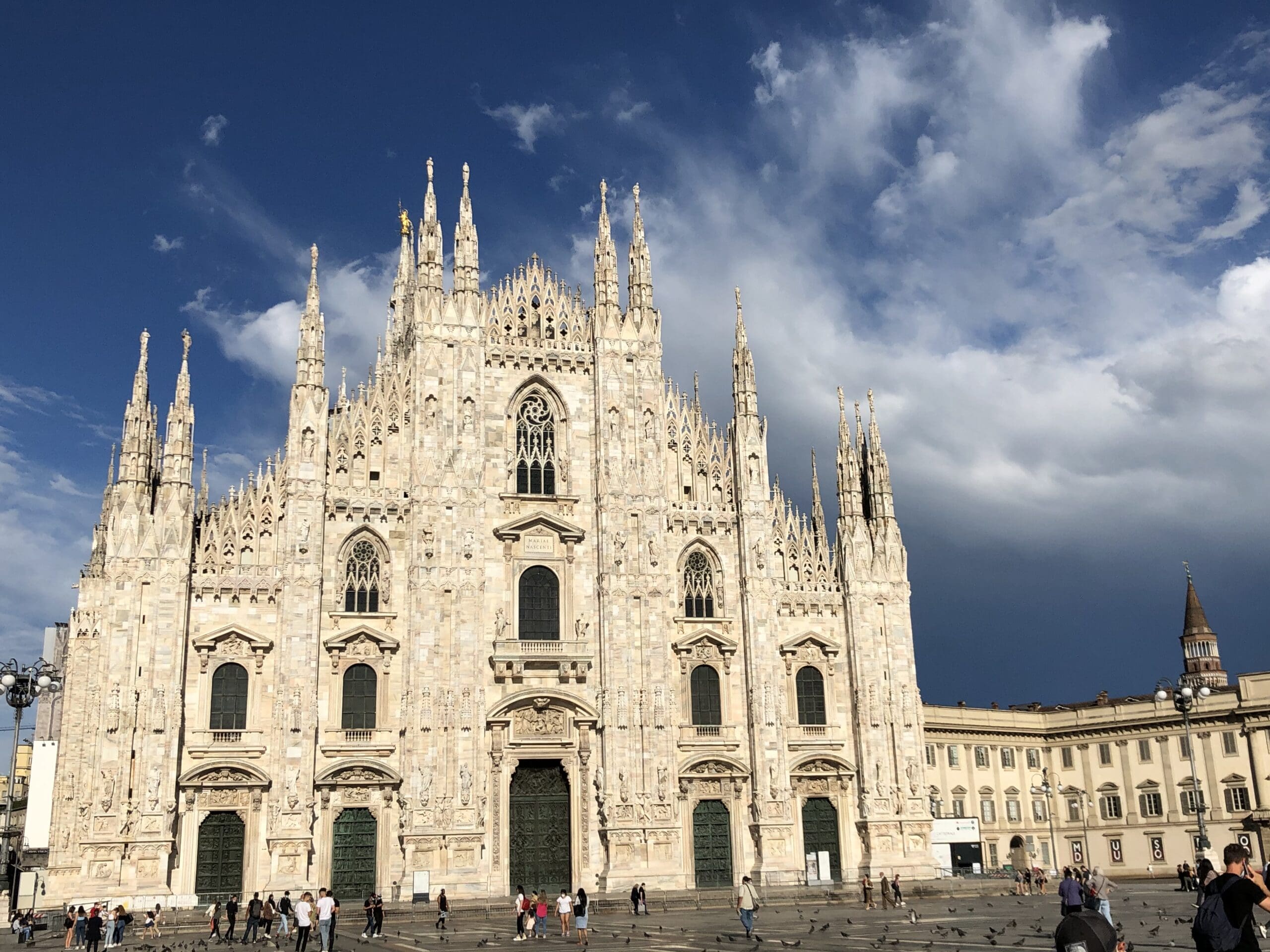 Intricate stained glass windows inside Duomo di Milano. 